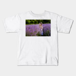 Beautiful little girl in a lavender field Kids T-Shirt